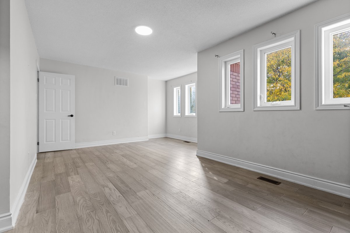 An empty, freshly finished room ready for its next owner