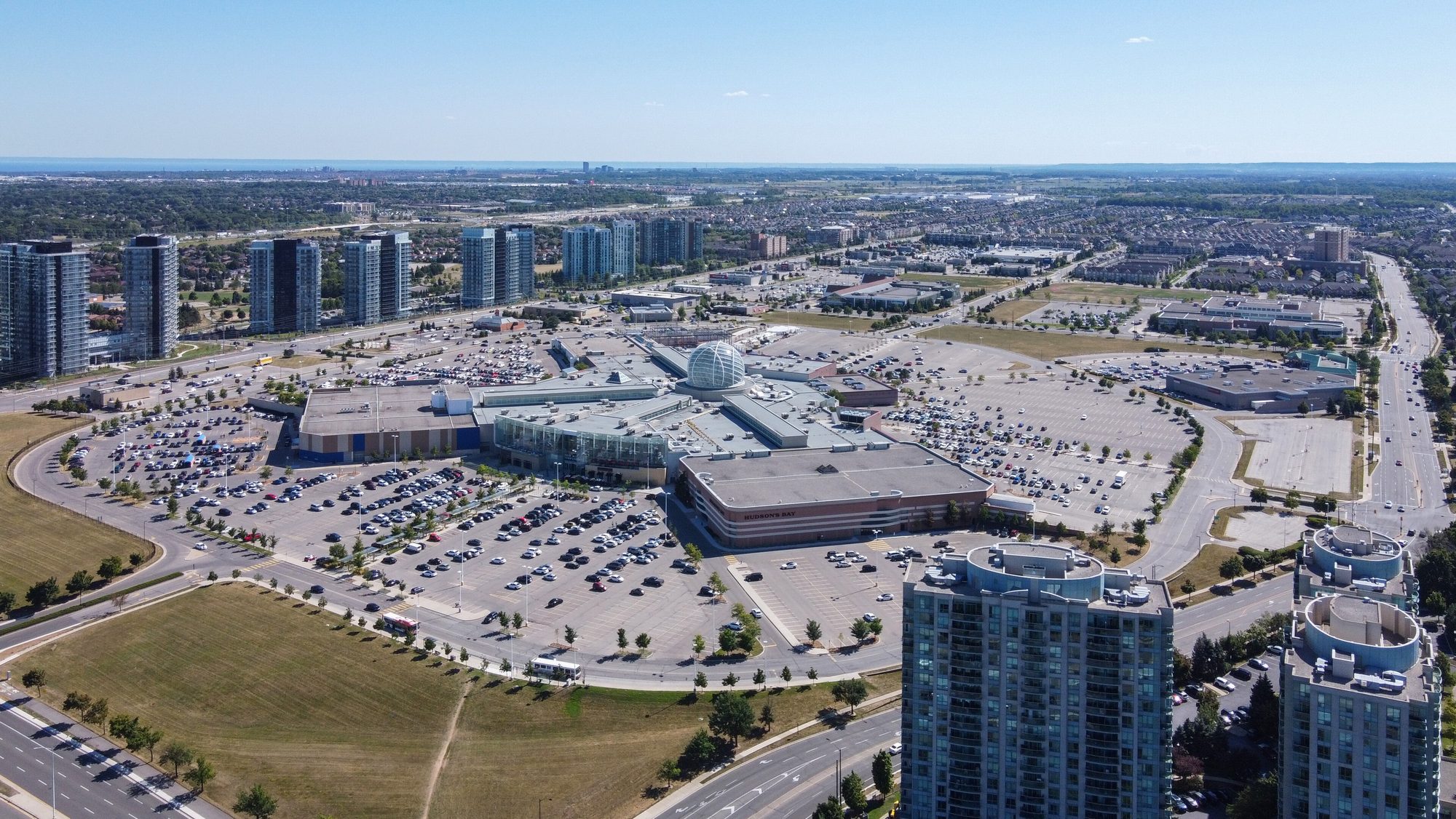 Erin Mills Town Centre from the air, the glass sphere at its middle and the condo towers along the parkway