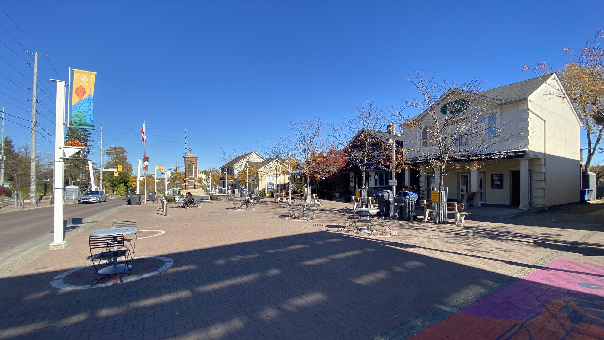 Streetsville Village Square on Queen Street South, banners up and the main street shops behind